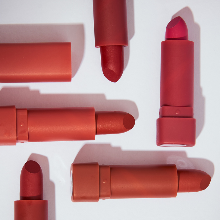 Lipsticks on White Background Flatlay